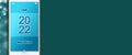 2022. Start. Button on a smartphone, on a green background. Concept for the start of the New Year 2022. Copy space Royalty Free Stock Photo