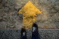 Start and Challenge Concept. a Business Man on Formal Shoes Steps to Follow a Yellow Arrow, Get Ready to Moving Forward or take a Royalty Free Stock Photo