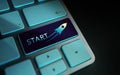 Start, Challenge, Start-Up and Motivation Concept. Close Up of Rocket and Startup Sign on Computer Keyboard