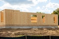 start of construction of a new plywood house wood framework property wall Royalty Free Stock Photo