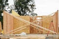 start of construction of a plywood house new home work real wall plank board Royalty Free Stock Photo