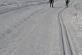 Start of the cross country skiing route. The tracks are prepared by a snowmobile with special attachments for pushing the track in Royalty Free Stock Photo