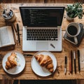 Developers Rustic Desk with Coffee and Croissants Royalty Free Stock Photo