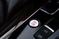 Start engine stop button Interior of modern luxury car. Details of automatic transmission gear shift, multimedia control Royalty Free Stock Photo