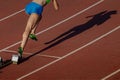 start female athlete from starting blocks running sprint distance Royalty Free Stock Photo