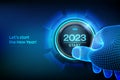 2023 start. Finger about to press a button with the text 2023 start. Happy new year. New Year two thousand and twenty one is