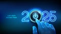 2025 start. Finger about to press a power button. Happy new year 2025. New Year two thousand and twenty five is coming concept.
