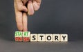 Start or finish story symbol. Concept words Start story and Finish story on wooden cubes. Beautiful grey table grey background. Royalty Free Stock Photo