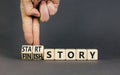Start or finish story symbol. Concept words Start story and Finish story on wooden cubes. Beautiful grey table grey background. Royalty Free Stock Photo