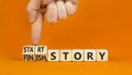 Start or finish story symbol. Concept words Start story and Finish story on wooden cubes. Beautiful orange table orange background Royalty Free Stock Photo