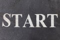 Start letters on an asphalt track texture Royalty Free Stock Photo