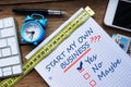 Start my own business question, conceptual image with personal agenda, computer keyboard and office objects on wooden table