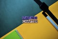 Start New Chapter text on top view color table background Royalty Free Stock Photo