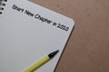 Start New Chapter in 2020 write on a book isolated on Office Desk Royalty Free Stock Photo