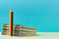 Start of new schoolyear. Time to school. Set for creativity. Colored pencils and stack of notebooks with coloured pages Royalty Free Stock Photo