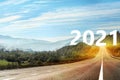 Start new year with fresh vision and ideas. Asphalt road leading to 2021 numbers Royalty Free Stock Photo