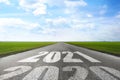 Start new year with fresh vision and ideas. 2021 numbers on asphalt road Royalty Free Stock Photo