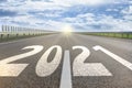 Start new year with fresh vision and ideas. 2021 numbers on asphalt road Royalty Free Stock Photo