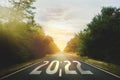 Start new year with fresh vision and ideas. 2022 numbers on asphalt road Royalty Free Stock Photo