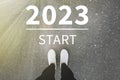 Start new year with fresh vision and ideas. 2021 numbers on asphalt road in front of woman, top view Royalty Free Stock Photo