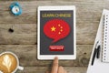 Start now to learn Chinese through online lesson using tablet computer Royalty Free Stock Photo