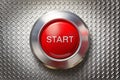 Start red button on metal plate background Royalty Free Stock Photo