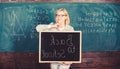 Start school year. Top ways to welcome students back to school. Teacher woman hold blackboard inscription back to school