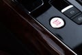 Start stop engine button Interior of modern luxury car. Details of automatic transmission gear shift, multimedia control Royalty Free Stock Photo