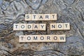 start today not tomorrow text on wooden square, motivation quotes Royalty Free Stock Photo