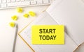 START TODAY text on the sticker on the diary with keyboard and pencil
