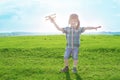 Start traveling from childhood even in imagination. happy child dreams of traveling and playing with an airplane pilot Royalty Free Stock Photo