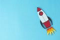 Start up business concept. Boost or increase incomes, salary. Drawn rocket on colorful blue background. Copy space Royalty Free Stock Photo