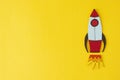 Start up business concept. Boost or increase incomes, salary. Drawn rocket on colorful yellow background. Copy space Royalty Free Stock Photo