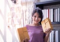 Start up business woman holding delivery boxes ready to send Royalty Free Stock Photo