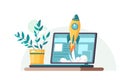 Start up. Concept for new business project, launching product or service with symbols. Laptop on the table with a flower pot. Royalty Free Stock Photo