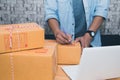 Start up small business entrepreneur SME or freelance asian man working with box at home concept, Young Asian small business owner Royalty Free Stock Photo