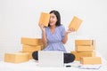Asian woman holding boxes, online marketing packaging box and delivery Royalty Free Stock Photo