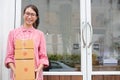 Start up small business owner holding parcel box at workplace. f Royalty Free Stock Photo