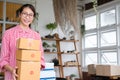 Start up small business owner holding parcel box at workplace. f Royalty Free Stock Photo