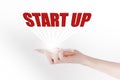 Start up text pop up on the smartphone in white background, start up business concept Royalty Free Stock Photo