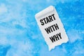 Start with why message written on white paper on blue background Royalty Free Stock Photo