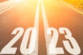 Start 2023 year concept. Numbers 2023 on the asphalt road before the start. Goals, plans, future, optimism, hope idea Royalty Free Stock Photo