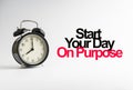 START YOUR DAY ON PURPOSE inscription written and alarm clock on white background Royalty Free Stock Photo