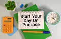 Start Your Day On Purpose text on notepad, concept background Royalty Free Stock Photo