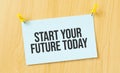 start your future today sign written on sticky note pinned on wooden wall Royalty Free Stock Photo