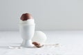 Chocolate egg on white eggstand holder Royalty Free Stock Photo