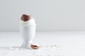 Chocolate egg on white eggstand holder Royalty Free Stock Photo