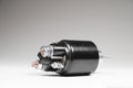 Starter solenoid for car on gray background. Auto parts