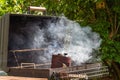 Starting BBQ charcoal in chimney Royalty Free Stock Photo