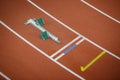 Starting blocks on track line on indoor arena Royalty Free Stock Photo